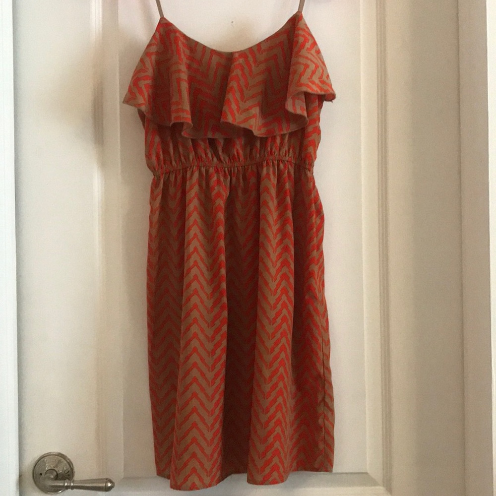 Adorable ruffle front orange and tan mini dress